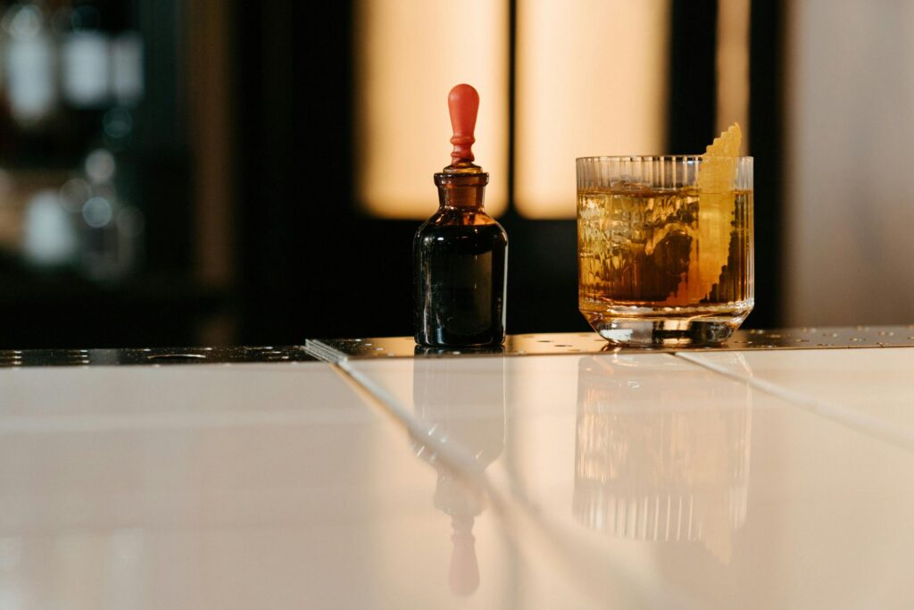 Photo by cottonbro studio: https://www.pexels.com/photo/brown-glass-bottle-beside-clear-drinking-glass-4667075/